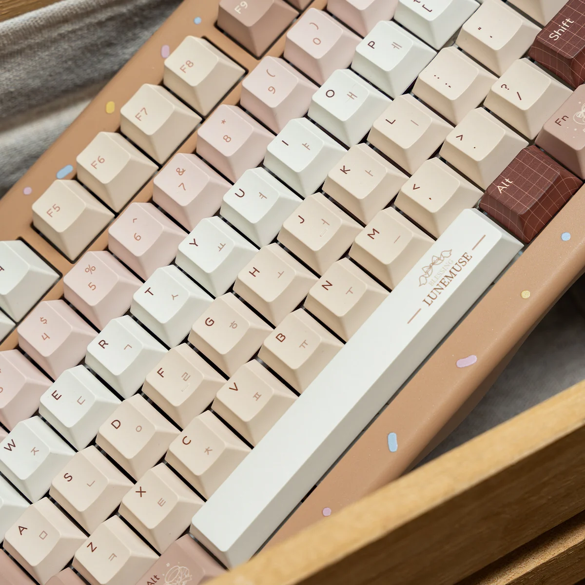 Caramel Maillard PBT dye-sub keycap set, durable and premium, shown from a unique angle. Highlights rich caramel and creamy tones.