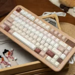Caramel Maillard PBT dye-sub keycap set, featuring rich caramel and creamy accents, beautifully displayed for a premium aesthetic.