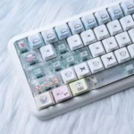 Charming Maltese Dog Keycaps Set with adorable minimalist line art, showcasing durable PBT and backlit features from playful angles.