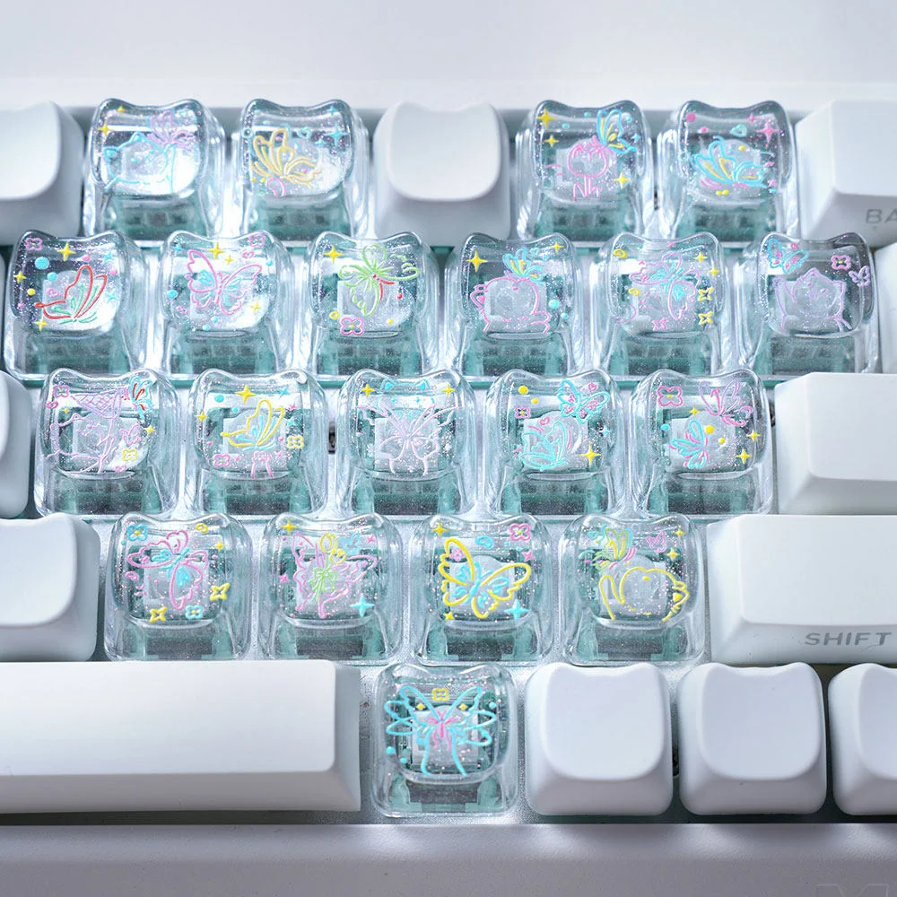 Artistic MAO Keycap Set gallery: transparent PC with elegant line art butterflies and hearts. Unique MAO profile keycaps viewed from multiple angles.