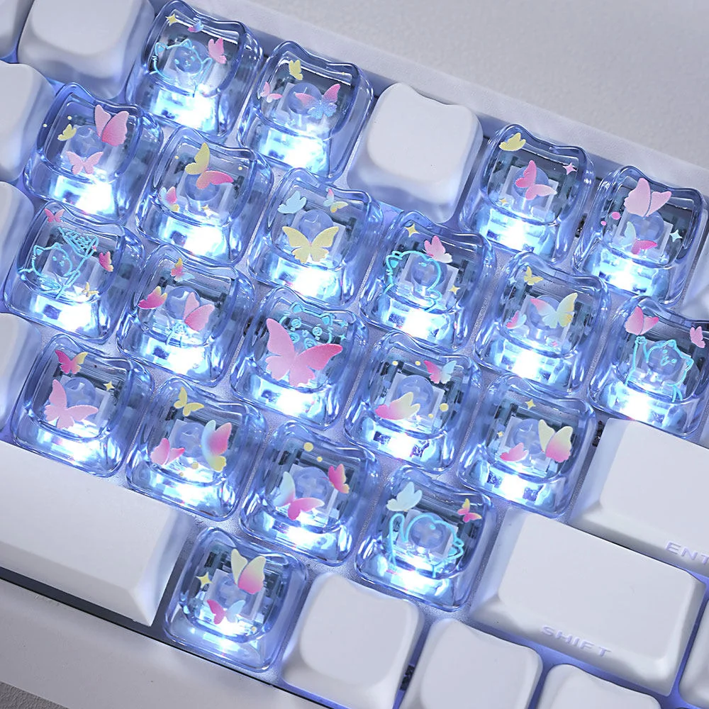 A collection of luminous MAO profile keycaps set, showcasing whimsical butterfly and heart designs from various angles, glowing with vibrant colors.