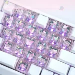 Gallery of luminous MAO profile keycaps set, showcasing whimsical butterfly heart accents glowing on translucent PC from various angles.