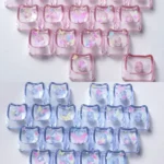 Luminous MAO profile keycaps set featuring whimsical butterfly heart accents glow with vibrant colors, showcasing their unique translucent PC design.