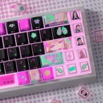 Close-up of vibrant Marin Kitagawa My Dress-Up Darling PBT+PC keycaps set, showcasing playful anime art and transparent PC accents for glowing backlighting.