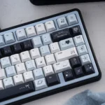Durable Mercury Blue & Pink Cherry Keycap Set. Ethereal blue-pink cosmic vistas showcase its artistic celestial design.