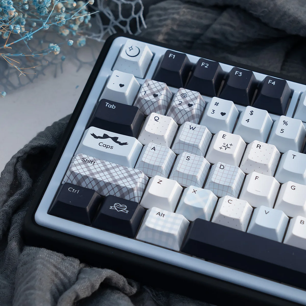 Detailed views of the Mercury Blue & Pink Cherry Keycap Set, emphasizing the durable PBT construction and ethereal blue and pink cosmic.