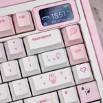 A playful close-up of the charming Pixel Miffy PBT keycaps, showcasing the vibrant pink pixel art design from a unique angle, perfect for keyboard.