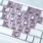 Whimsical Miffy & Friends translucent MAO supplement keycaps set featuring playful heart designs, glowing from multiple angles on a custom keyboard.