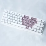 Playful Miffy & Friends translucent MAO supplement keycaps set, showcasing whimsical Miffy and heart designs glowing from multiple charming perspectives.