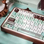 Premium Mint Chocolate PBT Dye-Sub SOA Keycaps Set, various angles. Highlights mint green and chocolate brown, evoking a sweet dessert parlor theme.