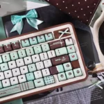 Premium Mint Chocolate PBT dye-sub SOA keycaps set. Refreshing mint green and chocolate brown. Various angles emphasize the sweet dessert parlor aesthetic.