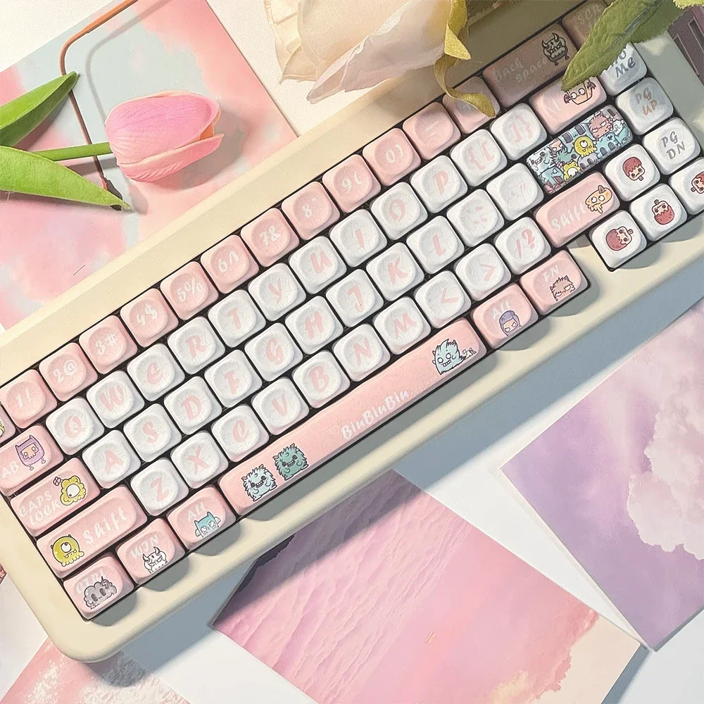 Strange Beast MOA PBT Keycaps set. Multiple views display whimsical monster art and the ergonomic MOA profile, perfect for playful, comfortable keyboard.