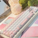 A collection of Strange Beast MOA PBT keycaps showcasing various whimsical monster designs and their uniform, ergonomic profile from multiple angles.