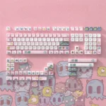 A vibrant collection of Strange Beast MOA PBT keycaps, highlighting their whimsical monster designs and ergonomic MOA profile from various angles.