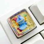 Vibrant, handcrafted translucent SA Mudkip keycap, a unique resin art piece beautifully capturing the beloved Pokemon character.
