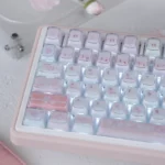 Adorable My Melody crystal jelly keycaps set, showcasing translucent pastel KDA profile keycaps from multiple playful angles.