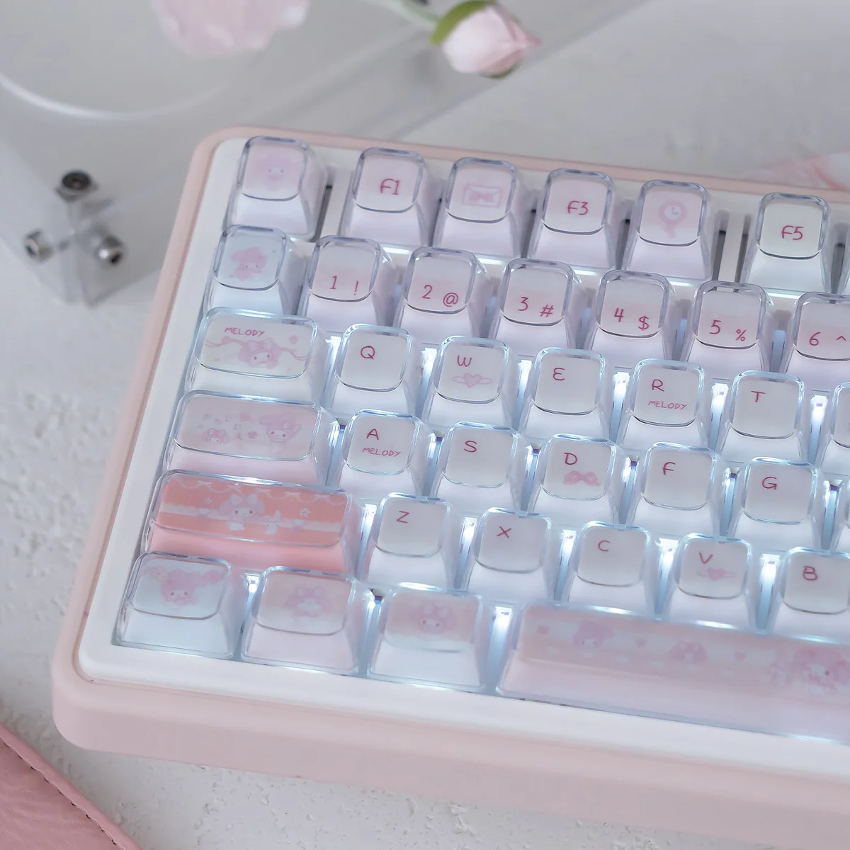 Adorable My Melody crystal jelly keycaps set, showcasing translucent pastel KDA profile keycaps from multiple playful angles.