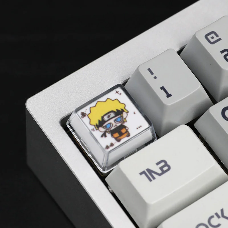 Naruto Chewing Resin Keycaps, a handcrafted artisan set. Vibrant anime characters in playful poses, showcasing lustrous resin from unique angles.