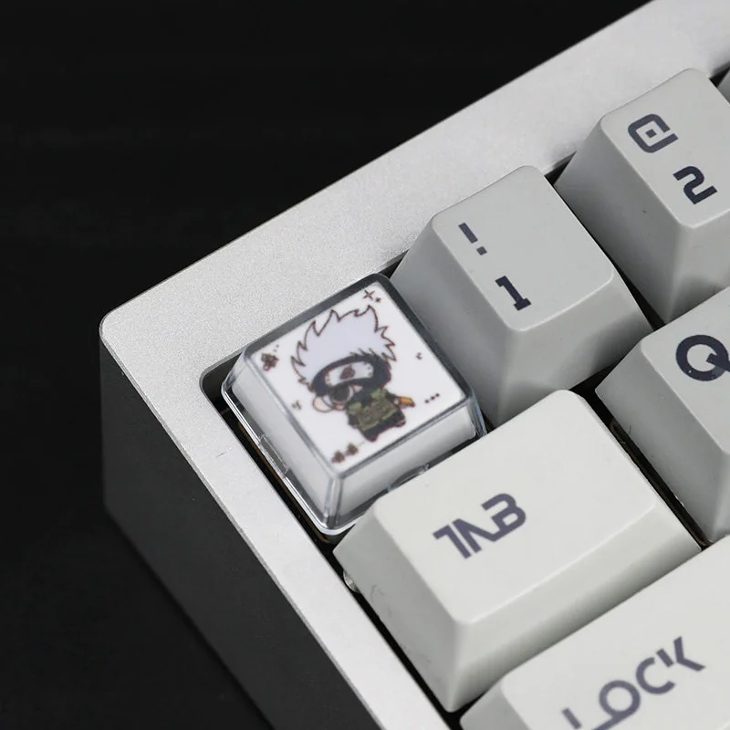 Gallery of exquisite handcrafted Naruto Chewing Resin Keycaps, showcasing vibrant anime characters in playful poses from multiple artistic angles.