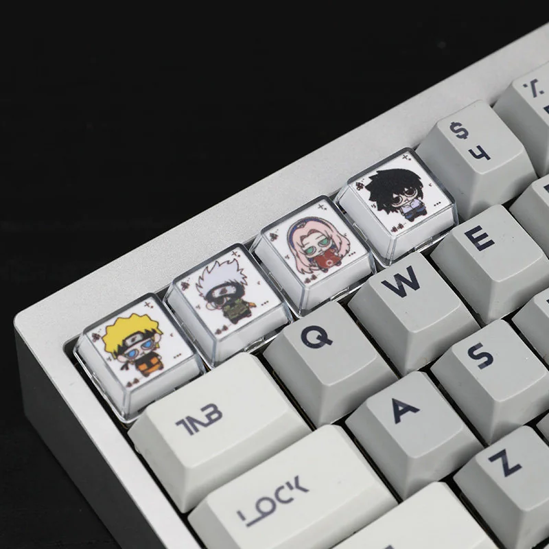 Close-up view of the exquisite handcrafted Naruto Chewing Resin Keycaps, showcasing vibrant, detailed anime characters in playful poses from multple angles.