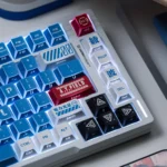 Side view of the exclusive NGE Lilith Dye-Sub PBT keycap set, highlighting its ethereal hues and artistic geometric design.