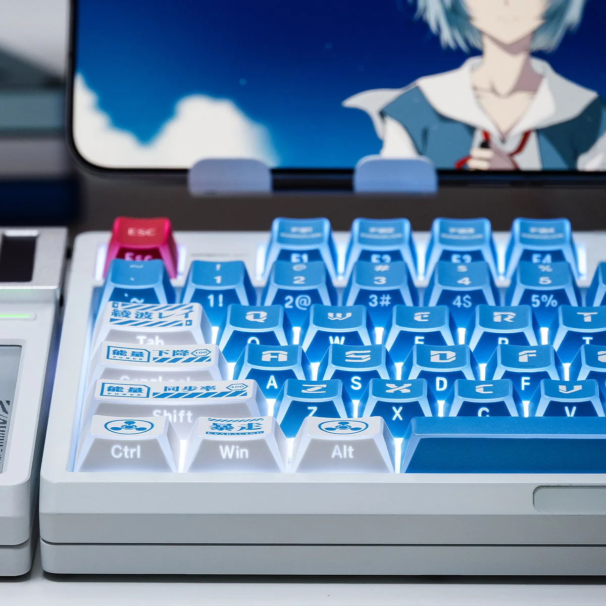 A detailed view of the exclusive NGE Lilith Dye-Sub PBT Keycap set, revealing its ethereal hues and striking geometric design.