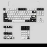 NieR Automata Keycaps Set featuring YoRHa 2B's iconic monochrome design. Close-up view of the durable Dye-Sub PBT keycaps showcasing intricate dystopian design.