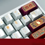 Notre-Dame PBT Keycaps Set, showcasing its pearlescent metallic finish and intricate Gothic architectural details. Elegant Notre-Dame keycaps.
