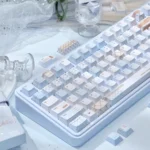 An artistic close-up of the unique Cocoa Blue PBT dye-sub keycap set, revealing its comforting warm cocoa and serene blue hues for a stylish desktop.