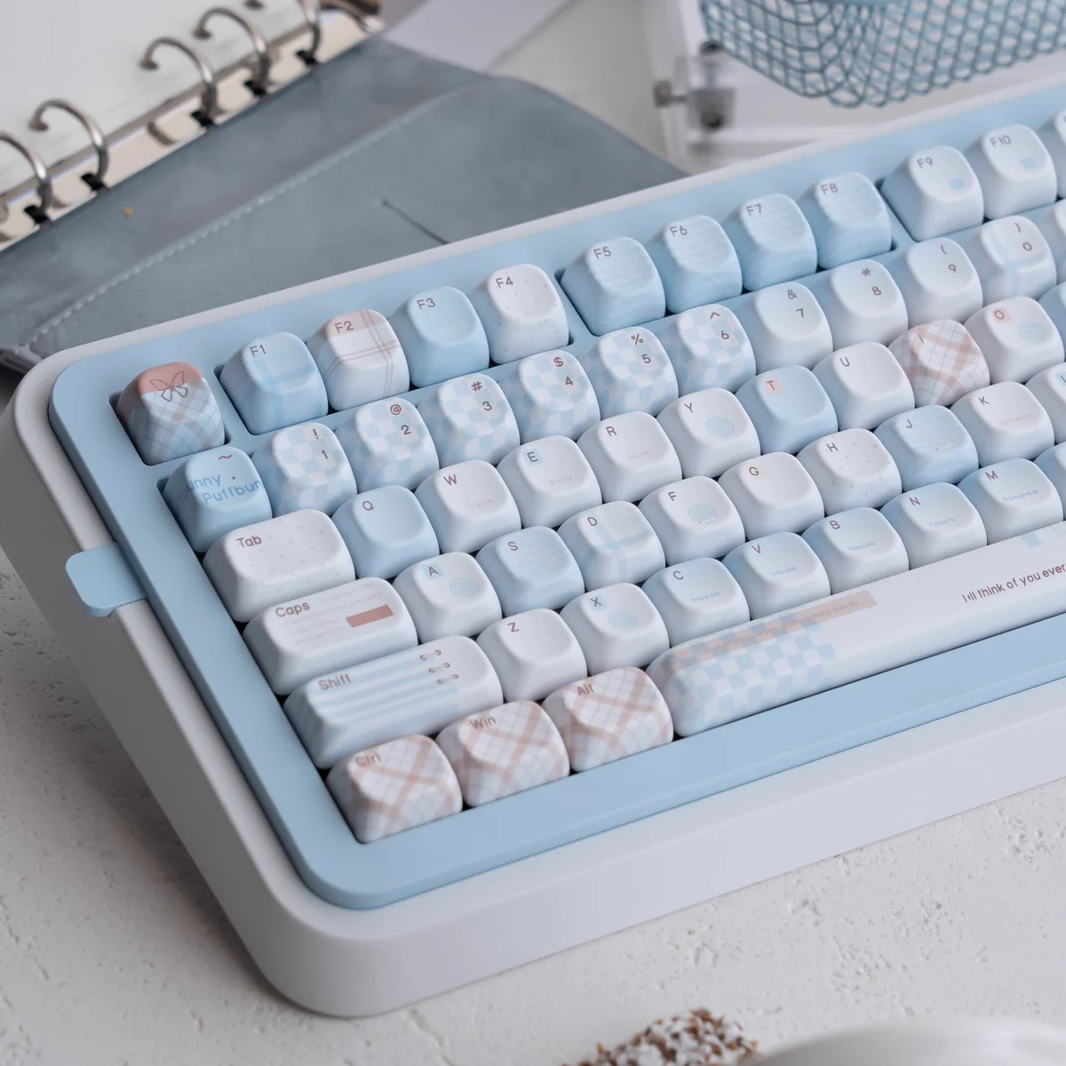 Close-up of the unique Cocoa Blue PBT dye-sub keycap set, displaying its warm cocoa and serene blue palette from various angles for a premium desktop.