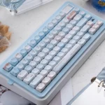 Cocoa Blue PBT Dye-sub keycap set, shown at various angles, featuring its unique premium finish and warm cocoa-blue look.
