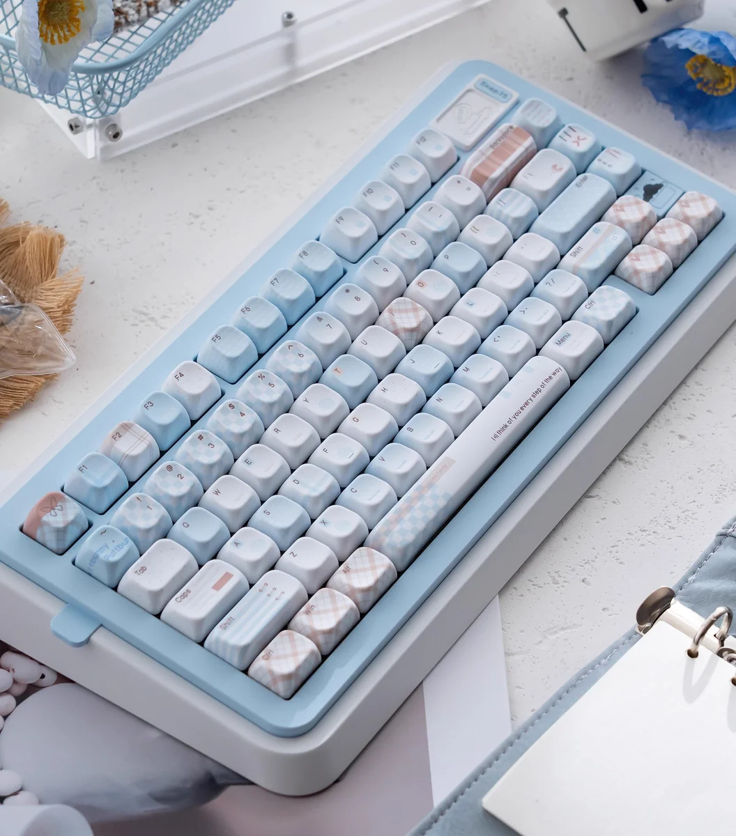 Cocoa Blue PBT Dye-sub keycap set, shown at various angles, featuring its unique premium finish and warm cocoa-blue look.