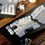 Premium PBT Sea Salt keycaps set from various angles, highlighting the tranquil, ocean-inspired dye-sub speckled pattern and durable construction.