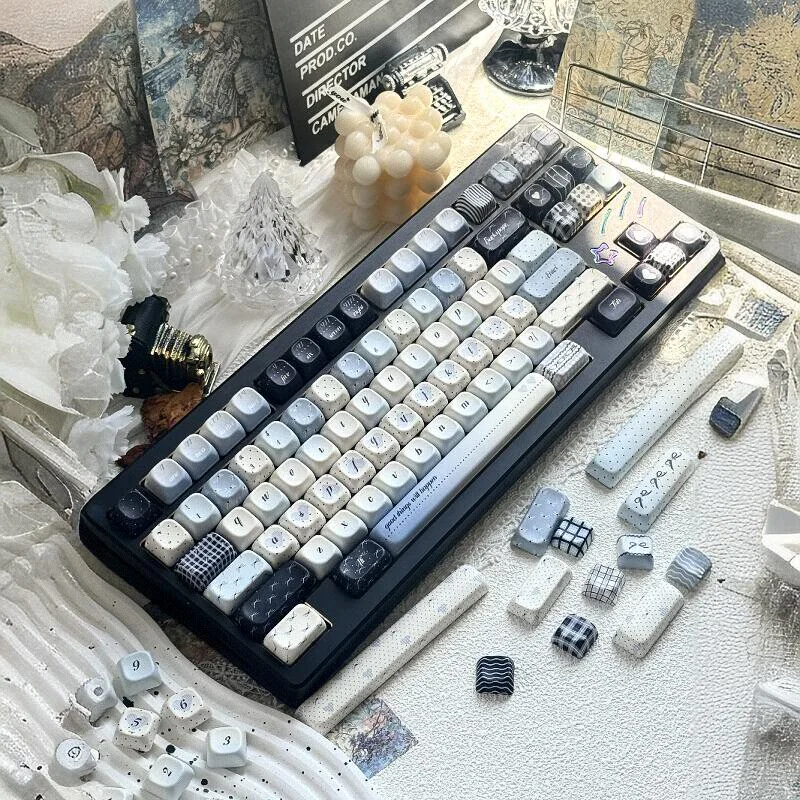 PBT Sea Salt Keycaps Set in tranquil minimalist design. Durable dye-sub PBT features a subtle speckled ocean pattern, shown from multiple angles.