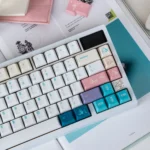 Close-up of the adorable Antarctic Adventure Cute Penguin PBT keycap set, showcasing the icy gradient and playful penguin designs.