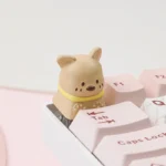 Angled view of a charming handcrafted pet cafe keycap, showcasing an adorable dog character sipping coffee in a cozy, whimsical pastel setting.
