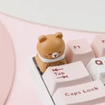 Close-up of a whimsical handcrafted pet cafe keycap, showing an adorable animal friend enjoying a pastel cafe scene, perfect for mechanical keyboards.