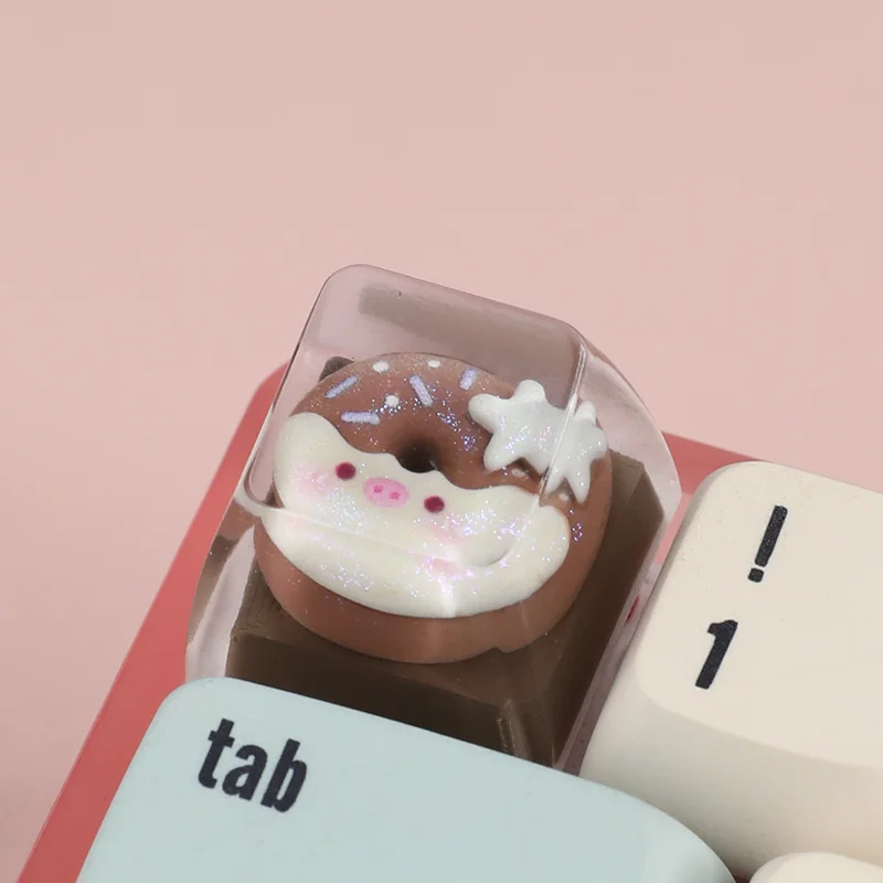Close-up of a handcrafted adorable piggy donut artisan ESC keycap from multiple angles, showcasing its vibrant colors and whimsical design.