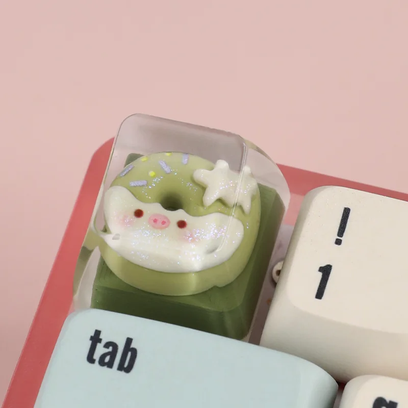 A collection of handcrafted adorable piggy donut artisan ESC keycaps shown from various angles, highlighting their sweet, whimsical details and vibrant design.