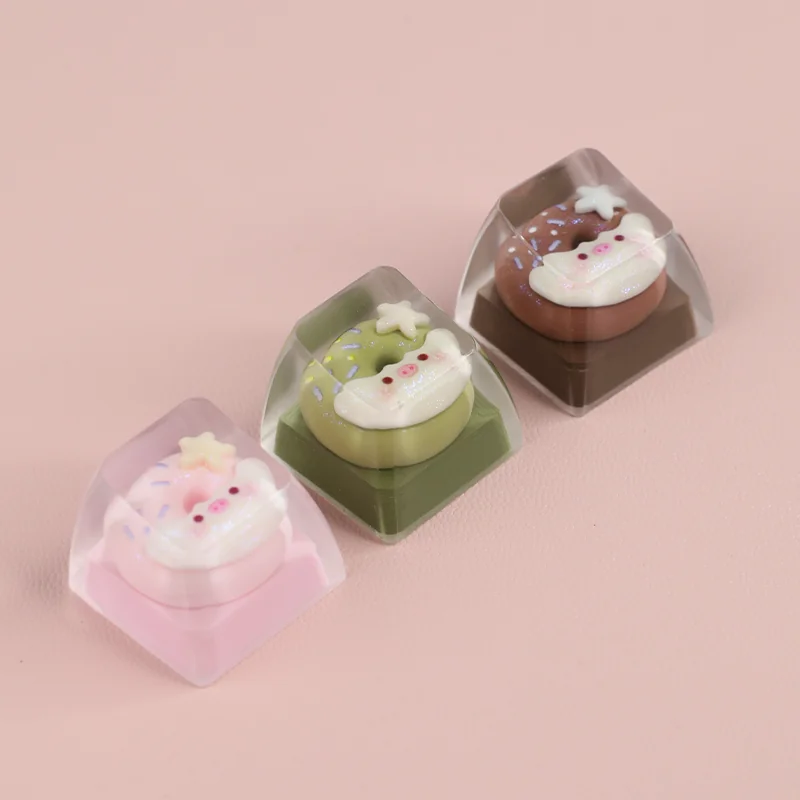 A close-up view of the adorable handcrafted piggy donut artisan ESC keycap, showcasing its whimsical dessert design from a charming angle.