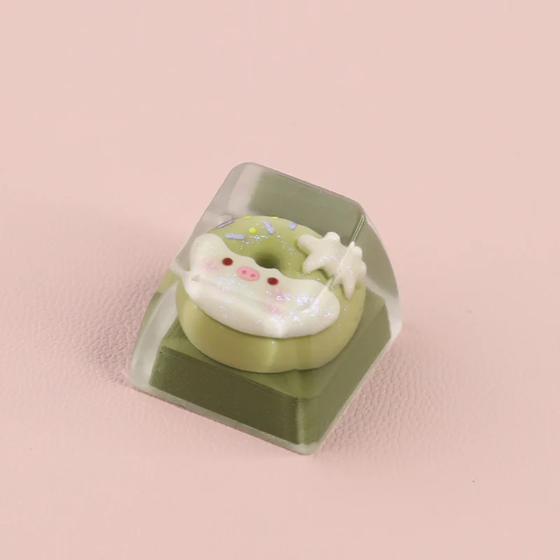 Adorable handcrafted piggy donut artisan ESC keycap, uniquely styled in a sweet matcha green, for a playful dessert-themed keyboard.