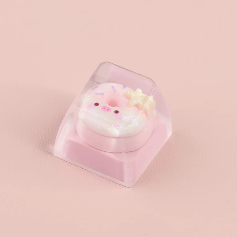 Handcrafted adorable piggy donut artisan ESC keycap, playfully designed with a sweet strawberry pink frosting and colorful sprinkles.