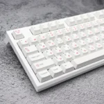 An adorable Pink Bear PBT keycaps set, artfully arranged to showcase whimsical pink bear designs on crisp white PBT for wide compatibility and premium design.