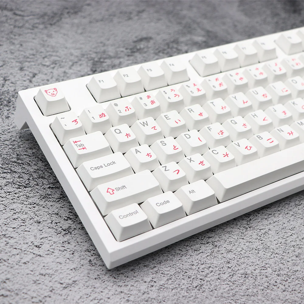 An adorable Pink Bear PBT keycaps set, artfully arranged to showcase whimsical pink bear designs on crisp white PBT for wide compatibility and premium design.