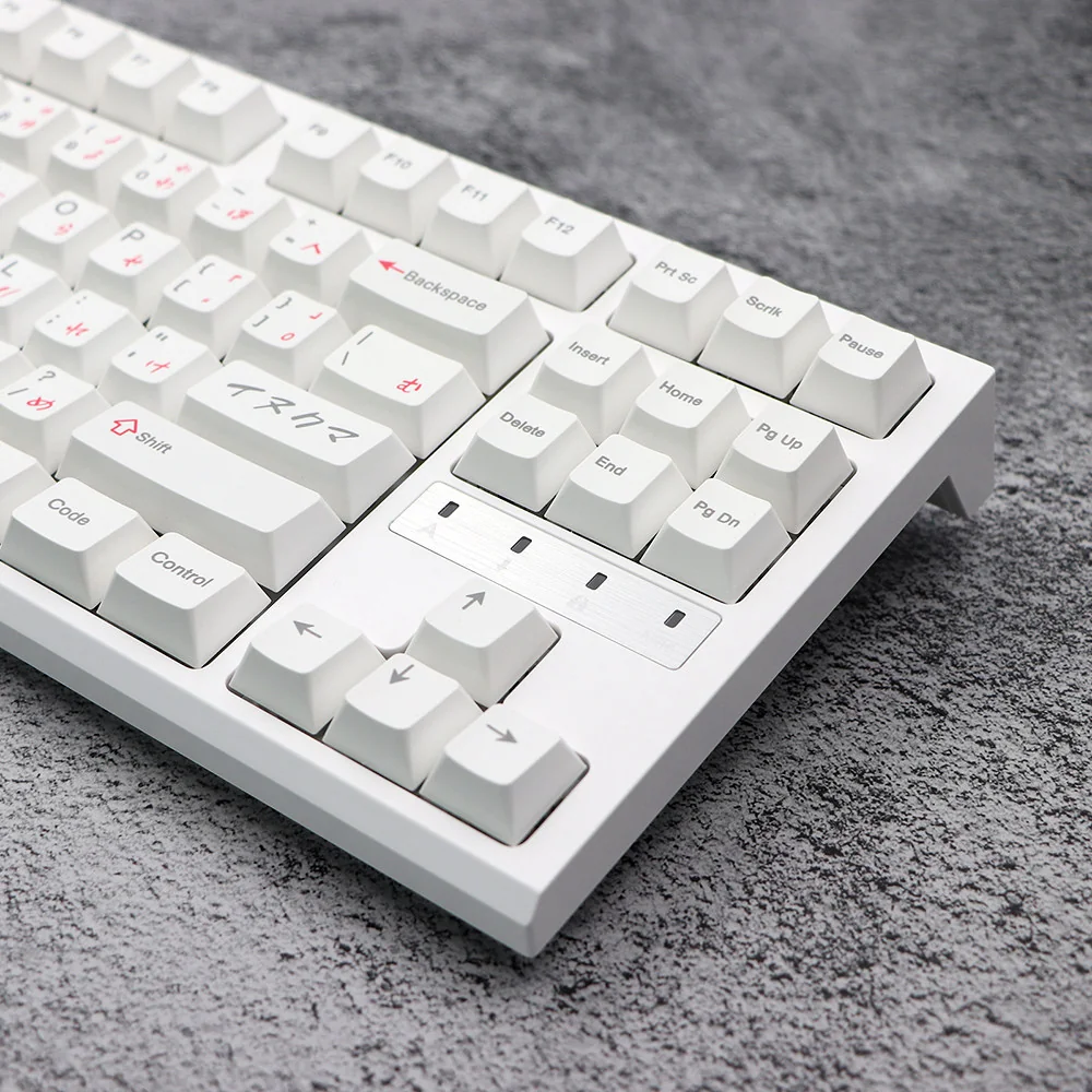 Pink Bear PBT Keycaps Set. A whimsical angle shows white keycaps with charming pink bear designs. Highlights premium quality and wide compatibility.