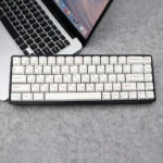 Adorable Pink Bear PBT Keycaps Set displayed, featuring whimsical white keycaps with charming pink bear designs and wide compatibility.