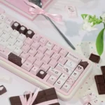 A Pink Chocolate Series Keycap Set, featuring charming hues keys with heart motifs, evoking playful dessert nostalgia.