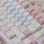 A close-up of the Dreamy Pink Star Keycaps set, showcasing its celestial pink design with delicate stars and whimsical patterns for a personalized keyboard.