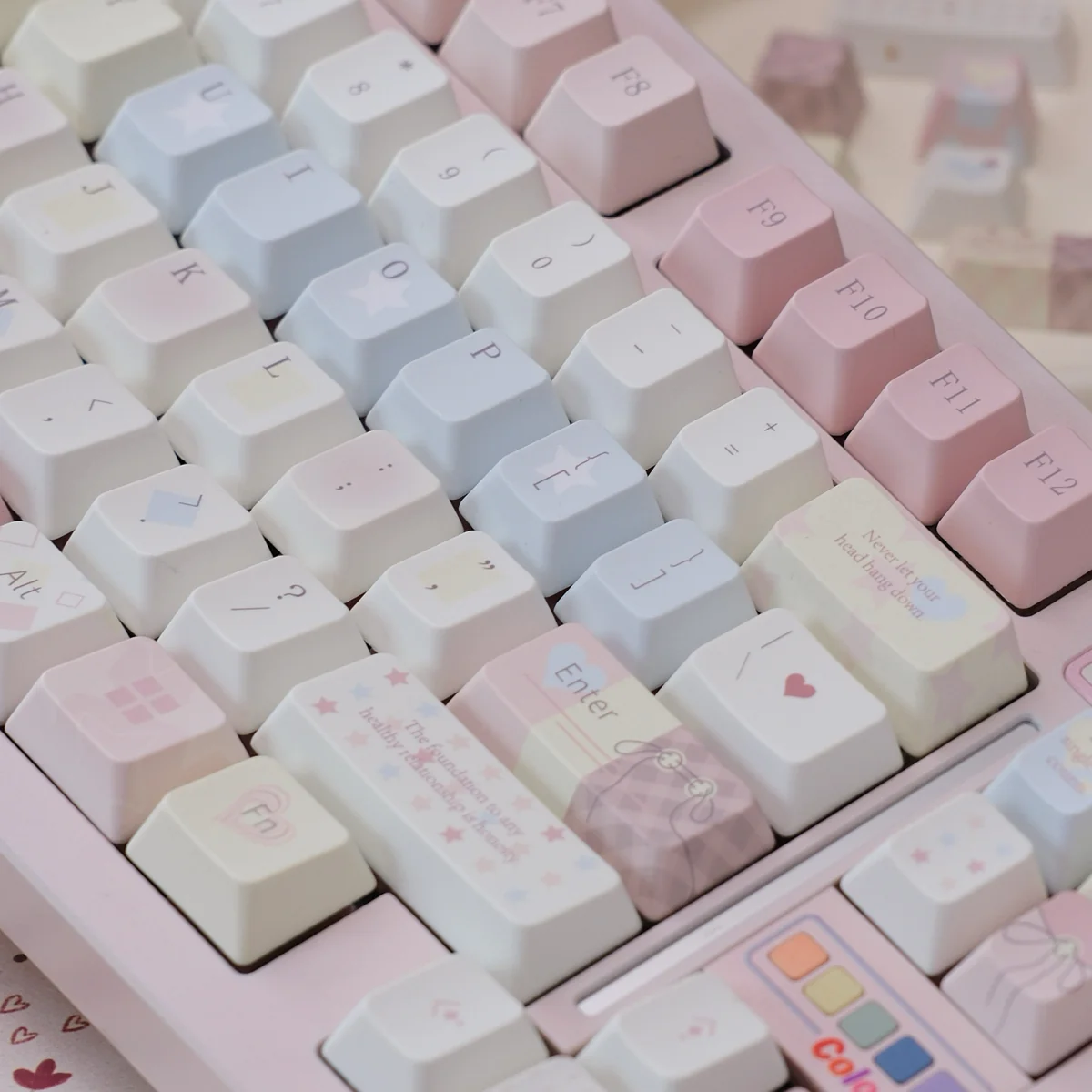 A close-up of the Dreamy Pink Star Keycaps set, showcasing its celestial pink design with delicate stars and whimsical patterns for a personalized keyboard.