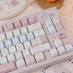 Dreamy pink star keycaps celestial keyboard set, beautifully displayed from multiple angles, featuring delicate star patterns and a whimsical astronomy.